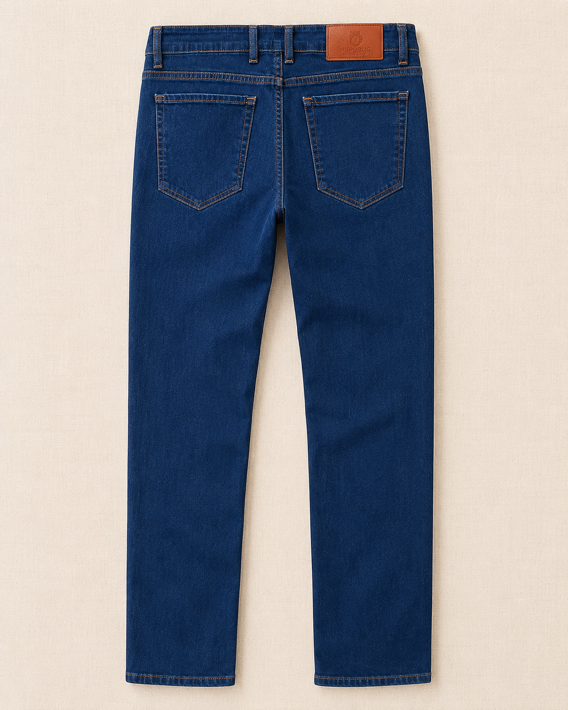Détail patch cuir cognac surpiqûres oranges jean bleu — Zalimi
